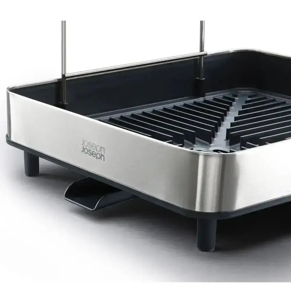 Stainless steel grill with black interior on a white background, featuring the Joseph Joseph brand.