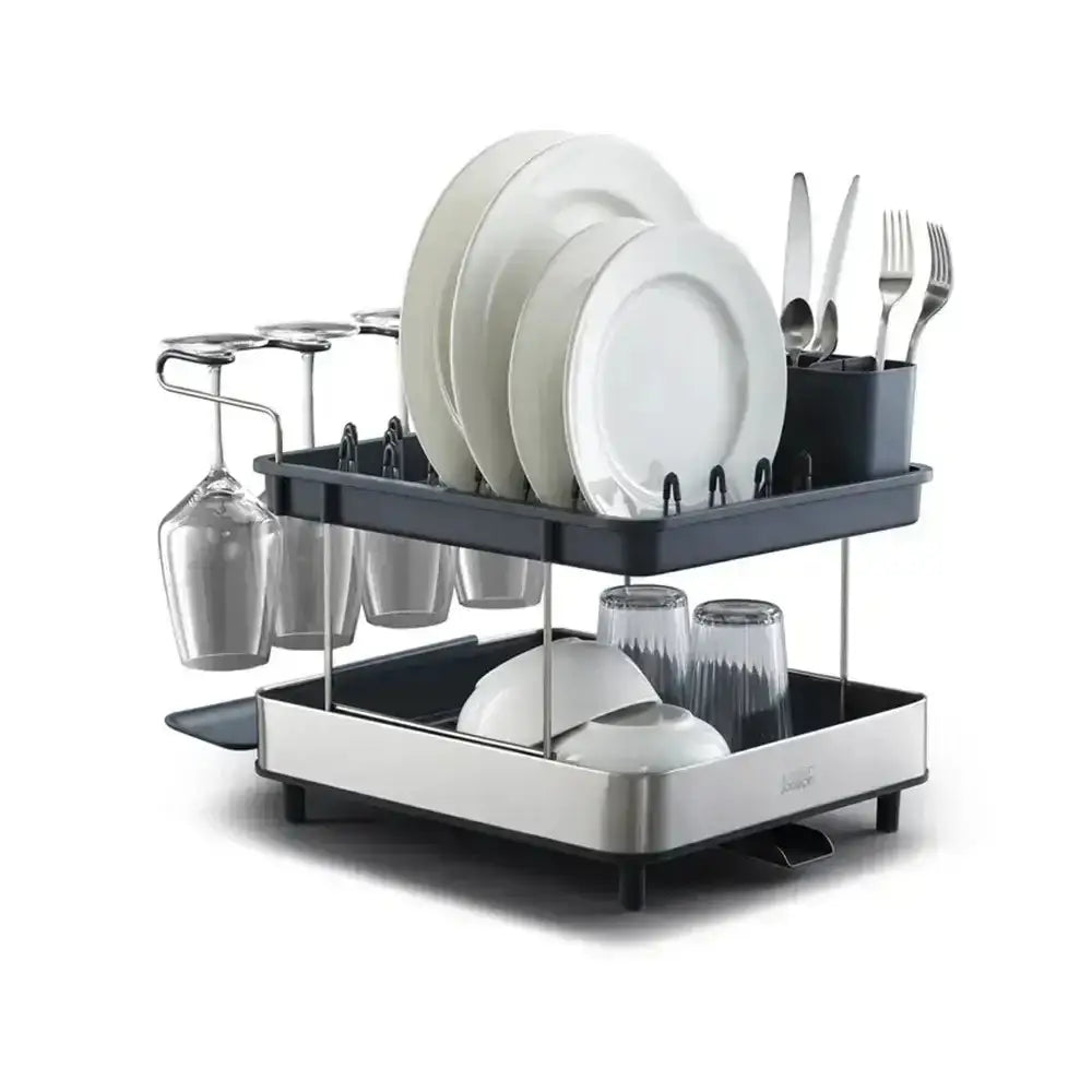 Two-tiered dish rack with plates, glasses, and cutlery on a white background