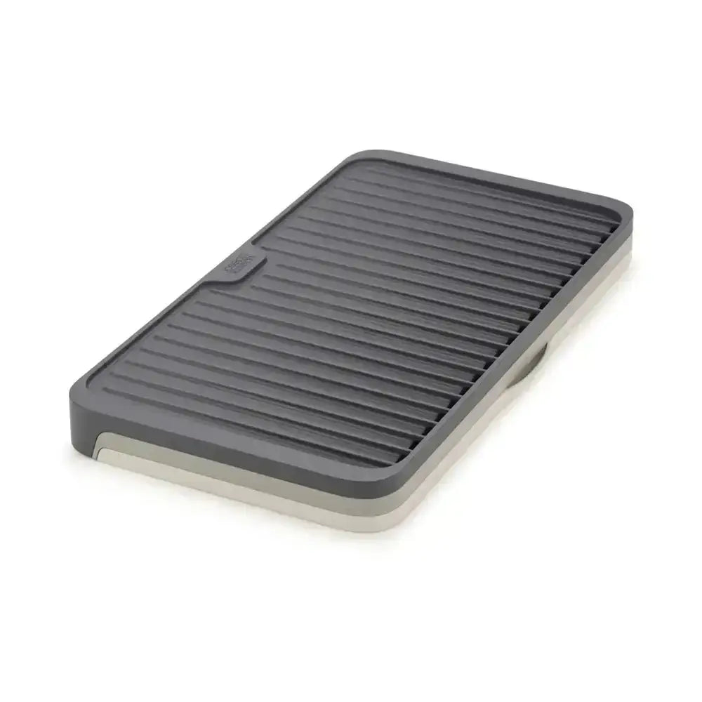 Gray draining mat on a white background