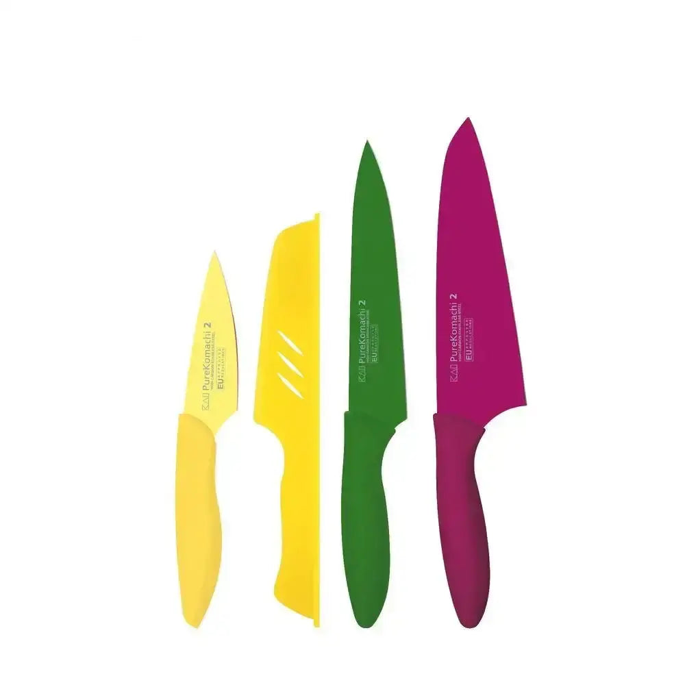 Set of four colorful knives with different handles on a white background