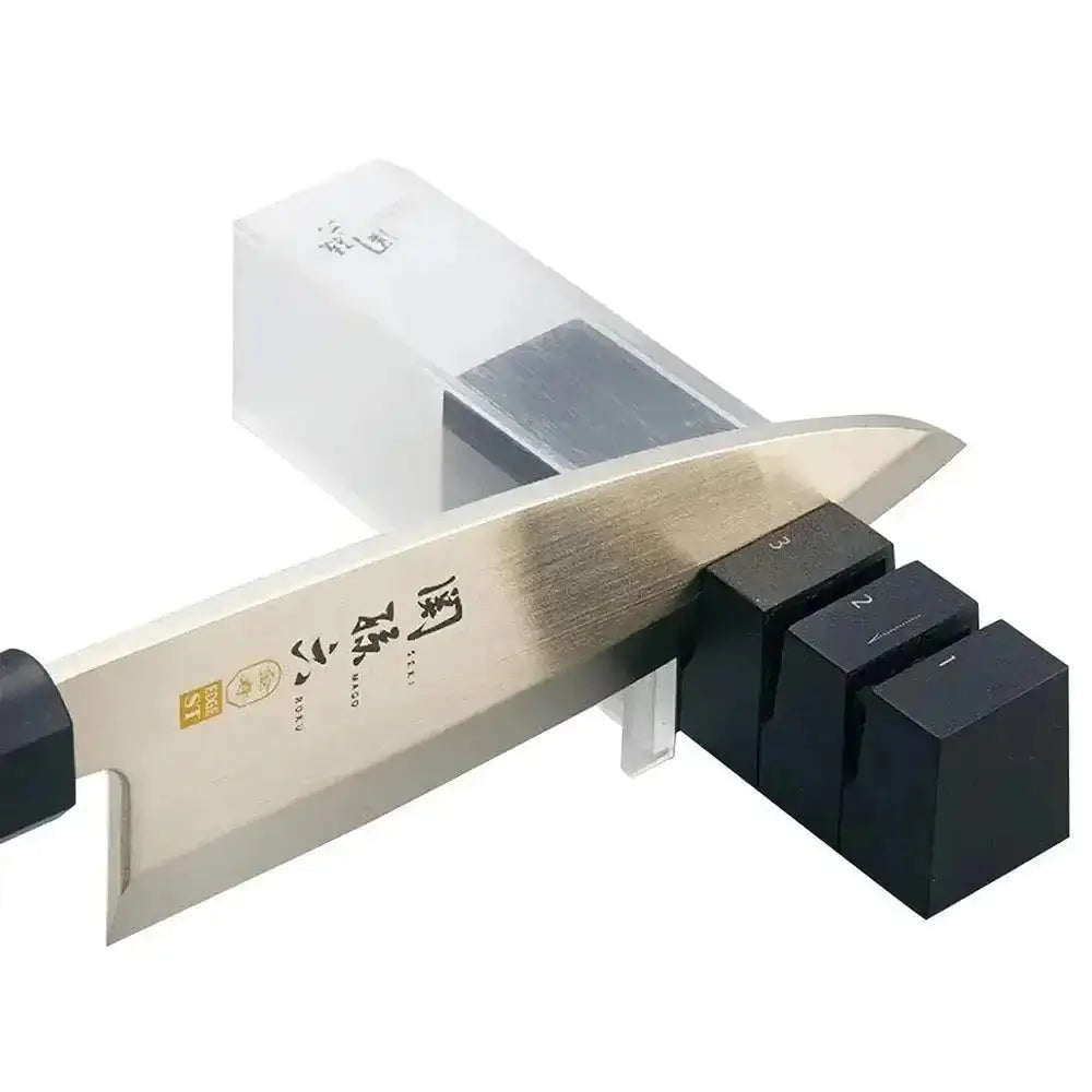 Knife sharpener with a knife inserted on a white background