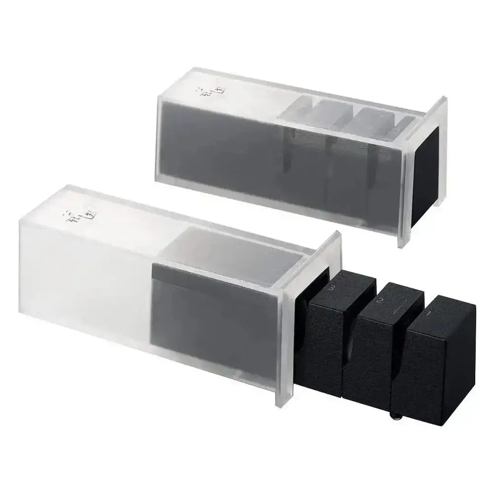 Two black knife sharpeners with clear plastic covers on a white background