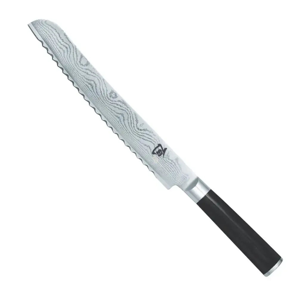 Serrated knife with a black handle on a white background