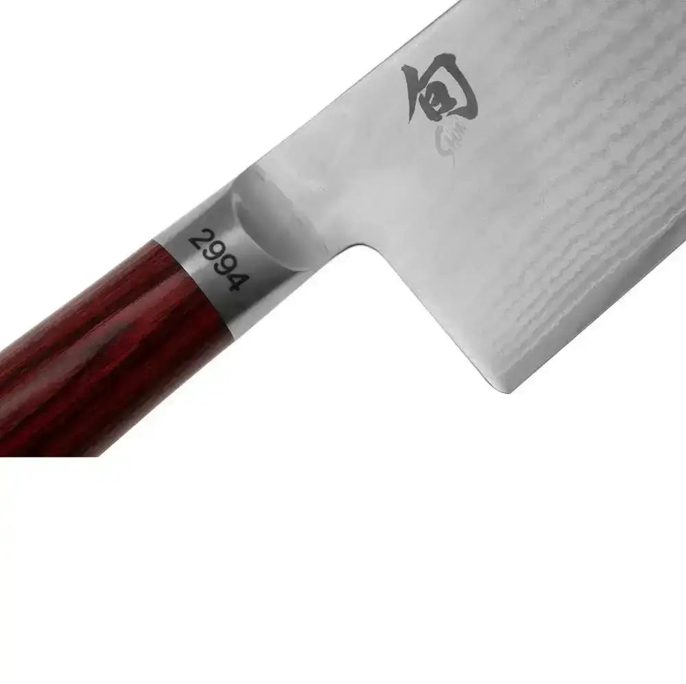 Close-up of a Shun chef's knife on a white background