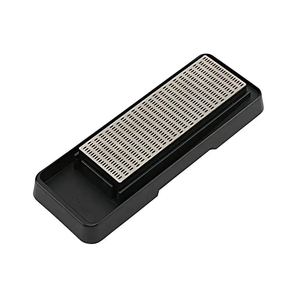 Black and beige whetstone on a white background
