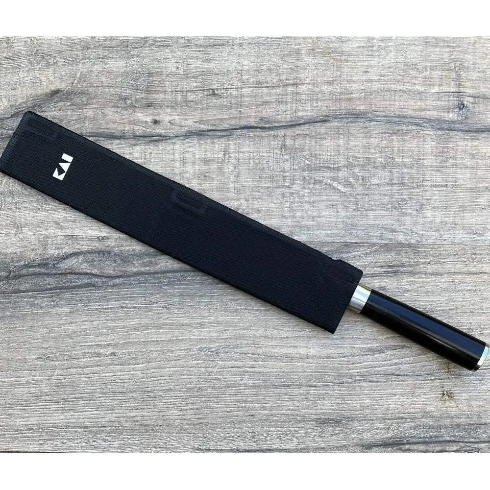Black knife sheath with a brand logo on a wooden surface