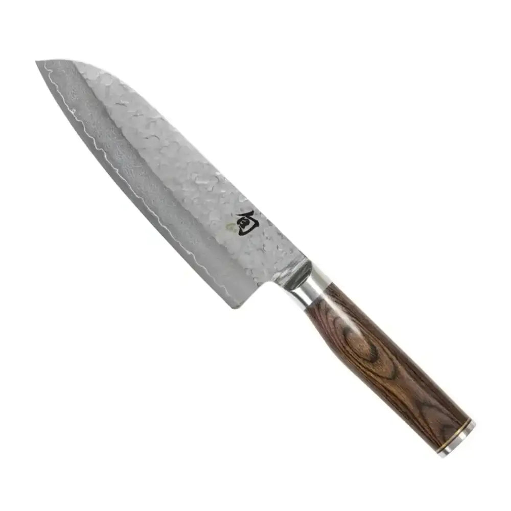 Damascus steel kitchen knife with wooden handle on a white background