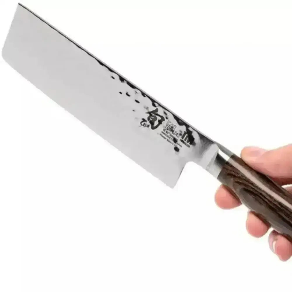 Knife held by a hand with a visible brand logo on a white background