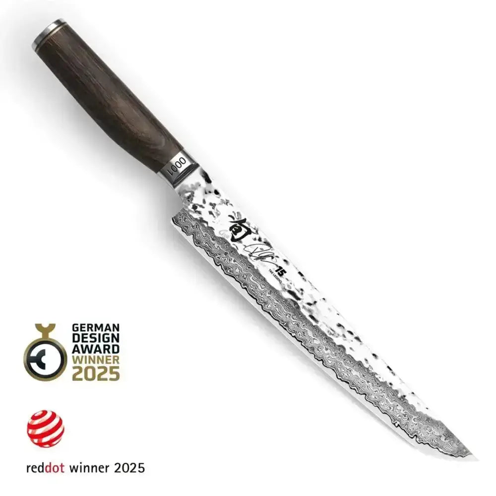 Chef's knife with a wooden handle on a white background, featuring Red Dot and German Design Award logos.