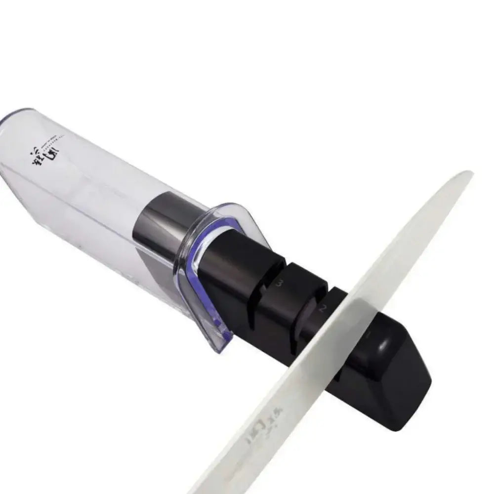 Knife sharpener with a white handle and black base on a white background