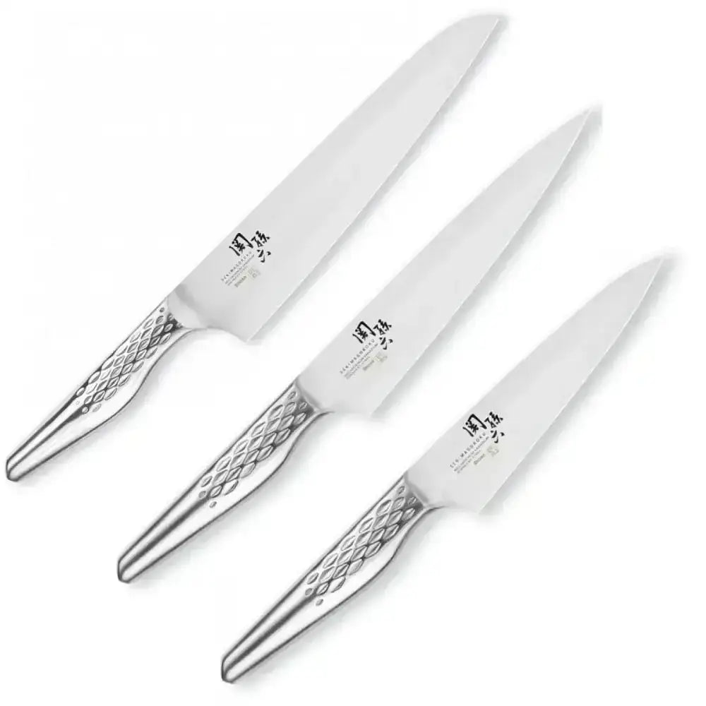 Three silver knives with decorative handles on a white background