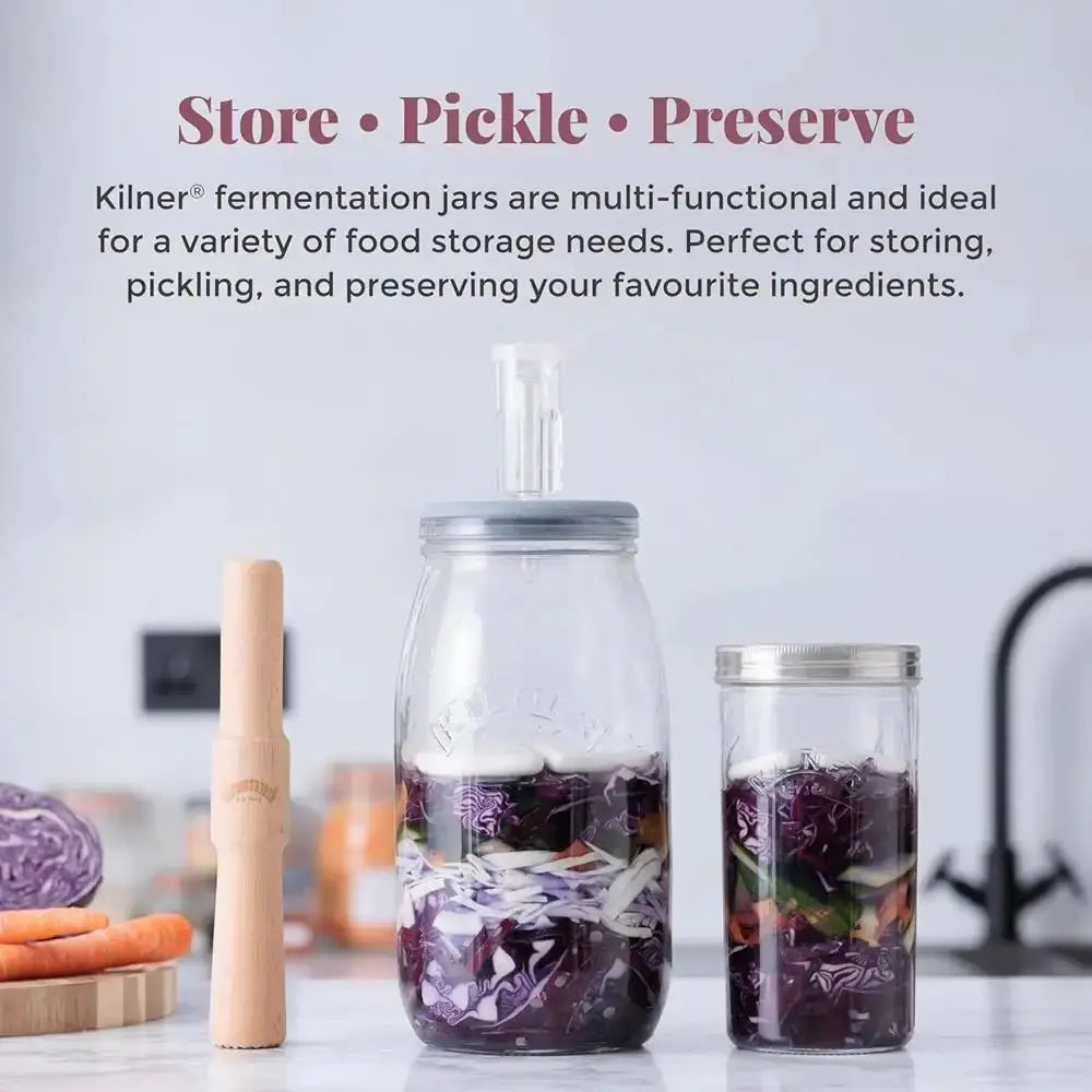 Kilner fermentation jars with text on a kitchen counter