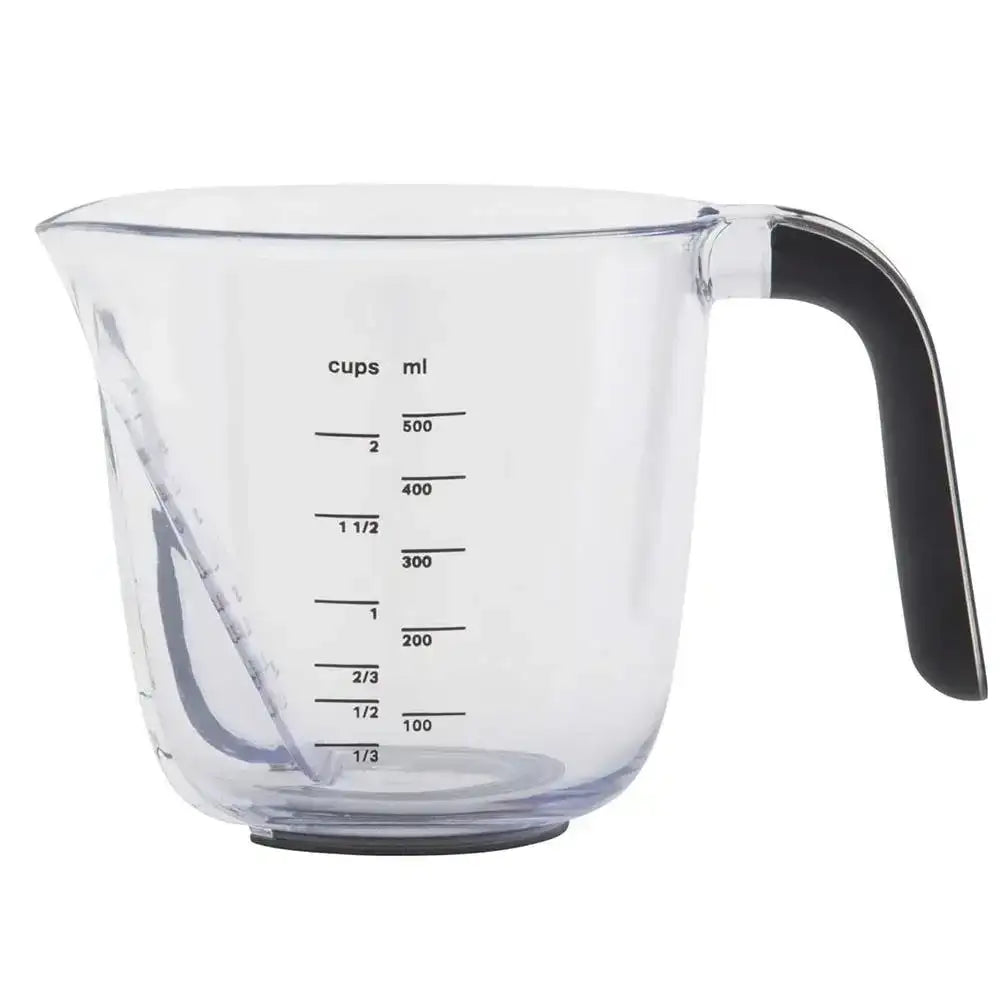 Clear measuring cup with black handle and measurement markings on a white background