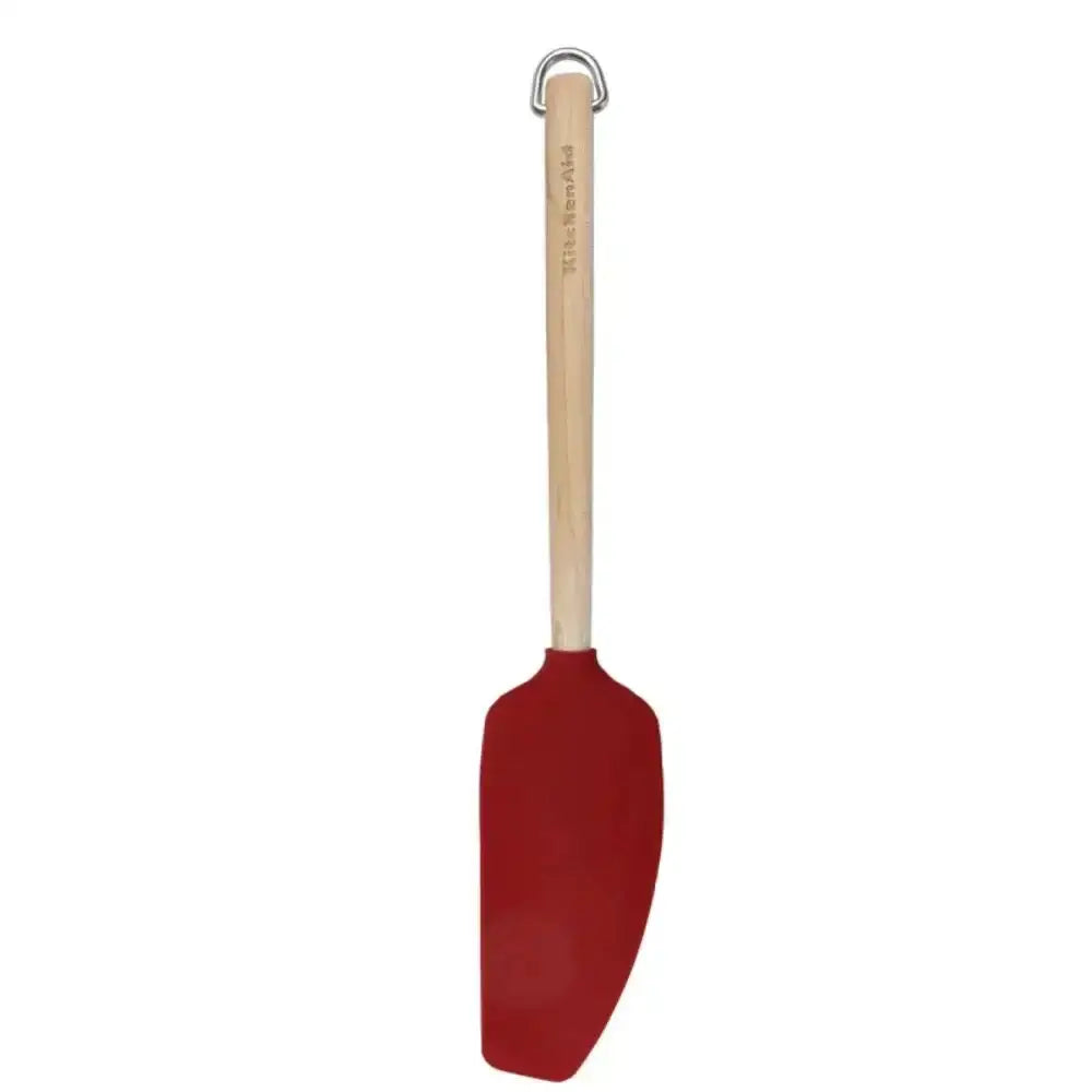 Red spatula with a wooden handle on a white background