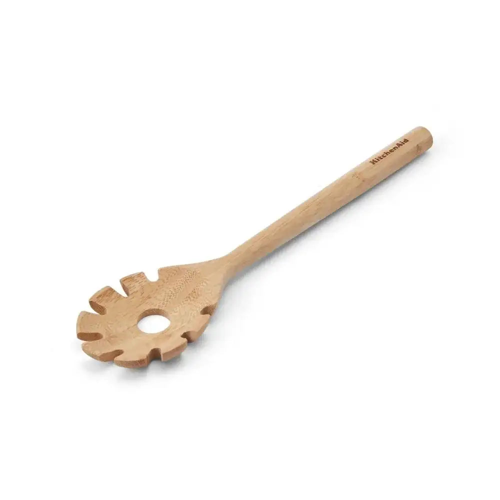 Wooden pasta server with unique design on a white background
