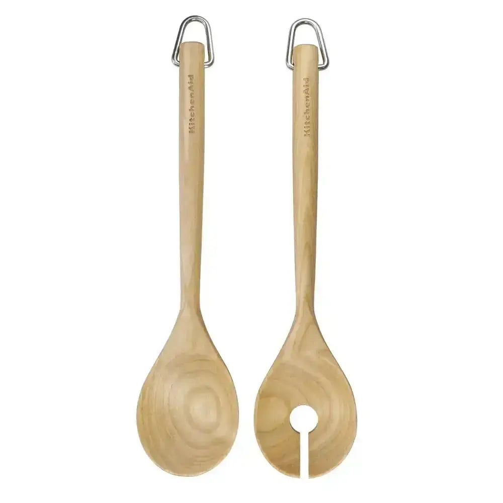 Two wooden spoons with metal handles on a white background