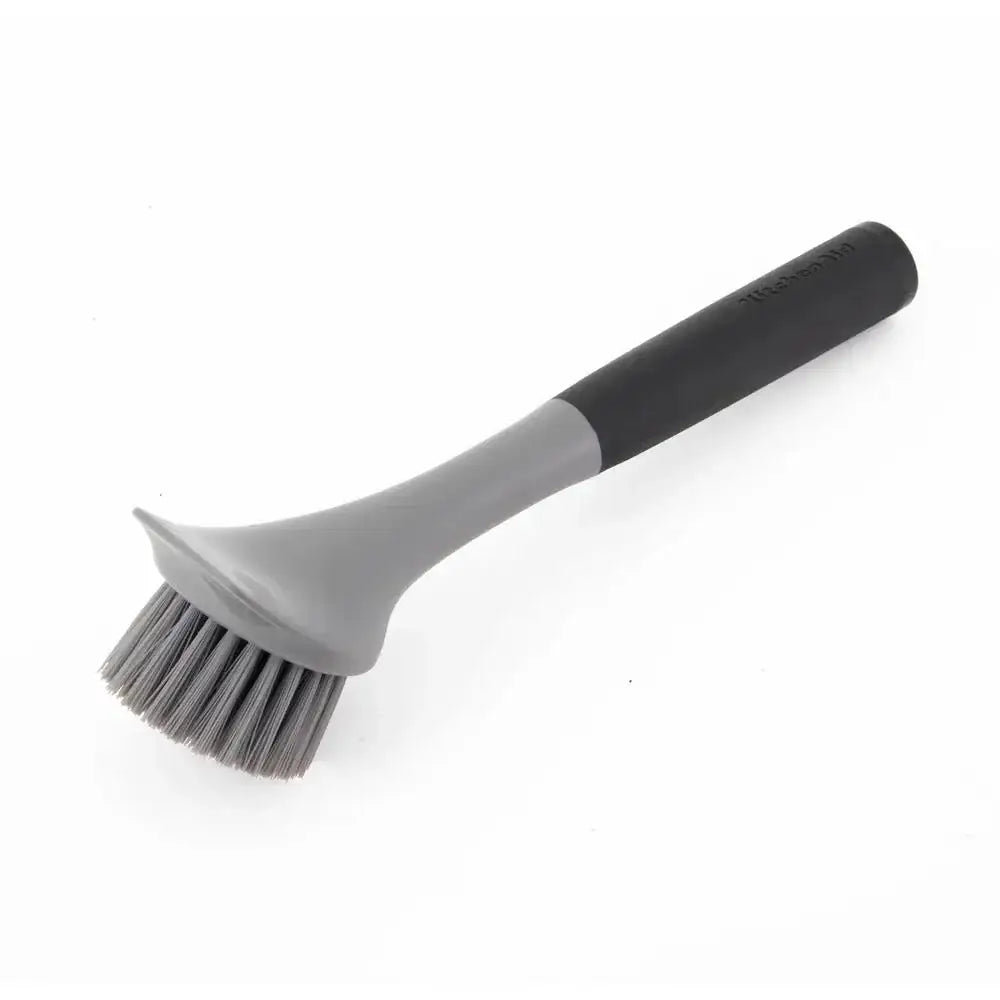 Gray and black scrub brush on a white background