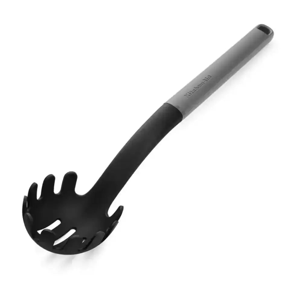 Black pasta server with gray handle on a white background