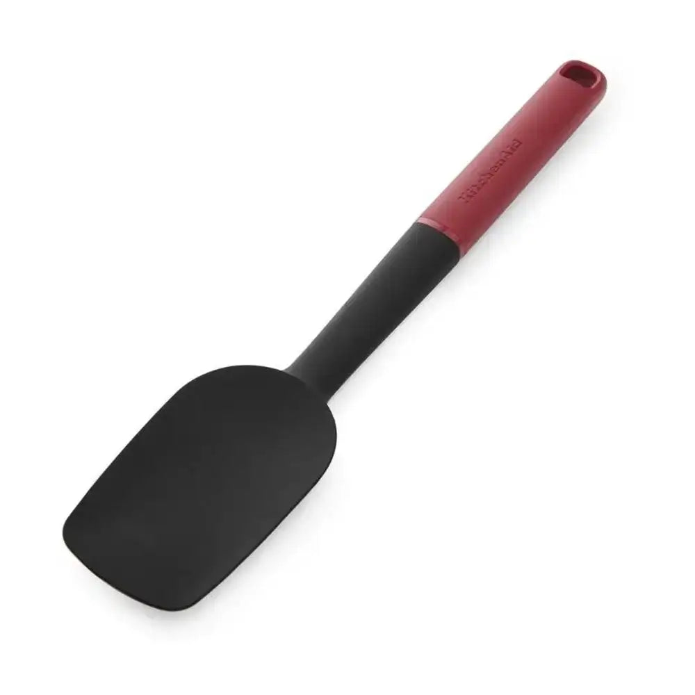 Black spatula with a red handle on a white background