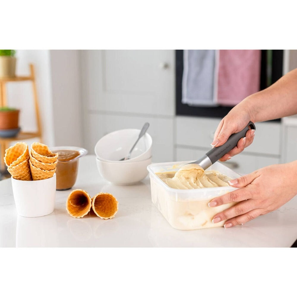 Kitchenaid classic stainless steel ice cream scoop grey with metallic blade scooping vanilla ice cream