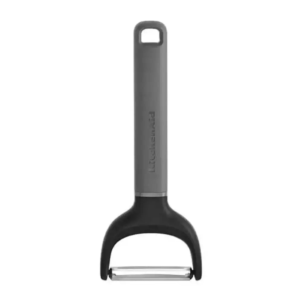 Gray and black peeler on a white background