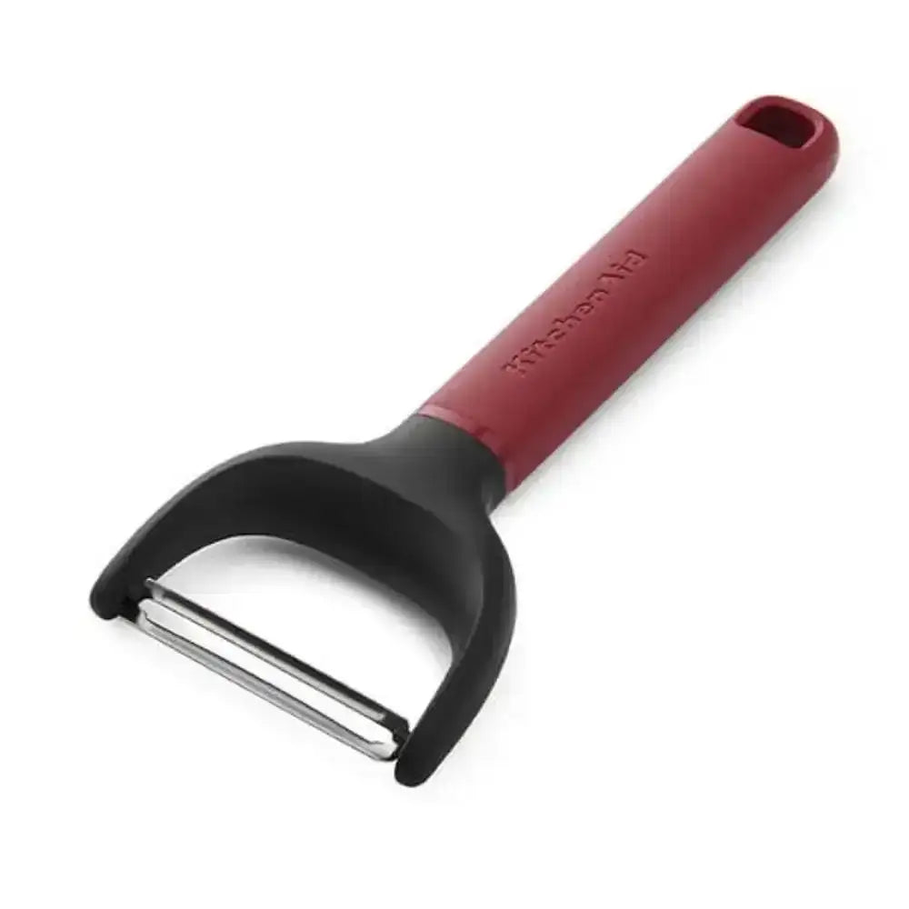 Red and black y-shaped peeler on a white background