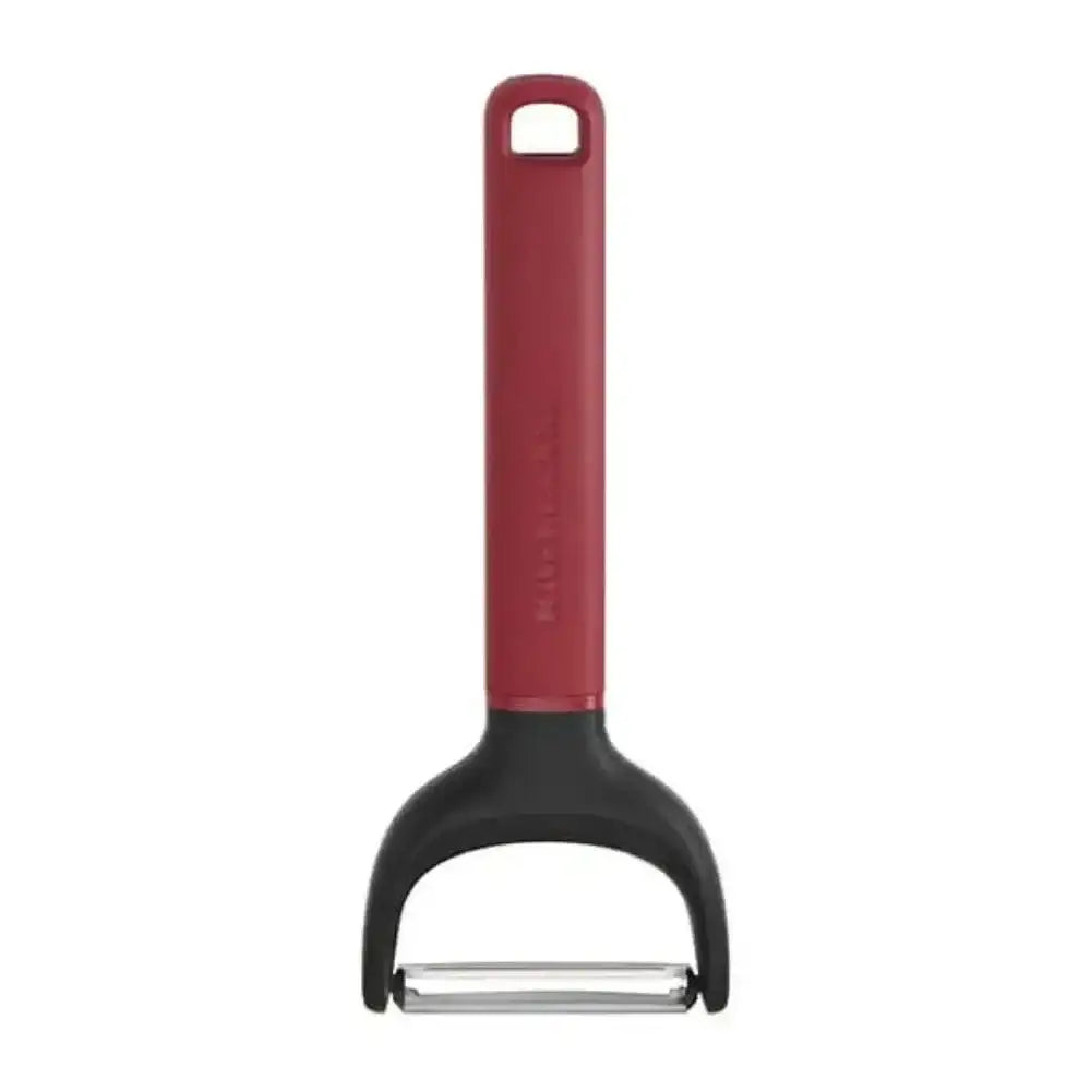 Red and black peeler on a white background