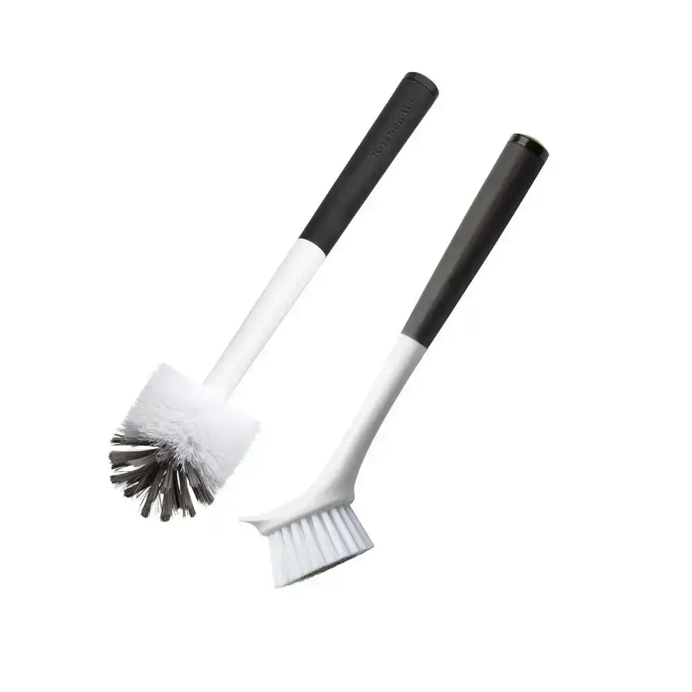 Two cleaning brushes with black handles on a white background