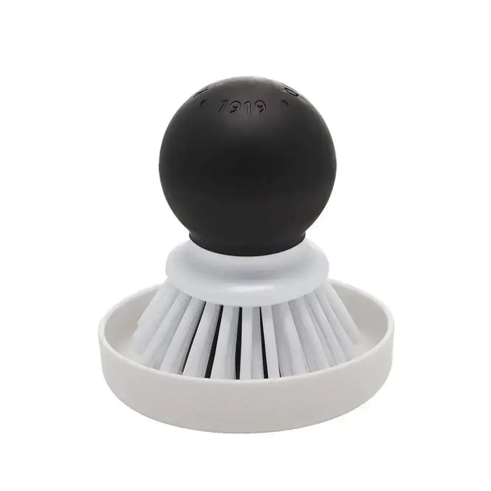Black and white scrubber with a spherical head on a white background