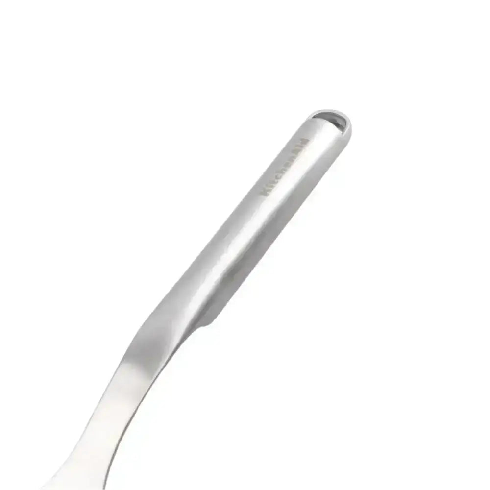 Metallic spoon on a white background