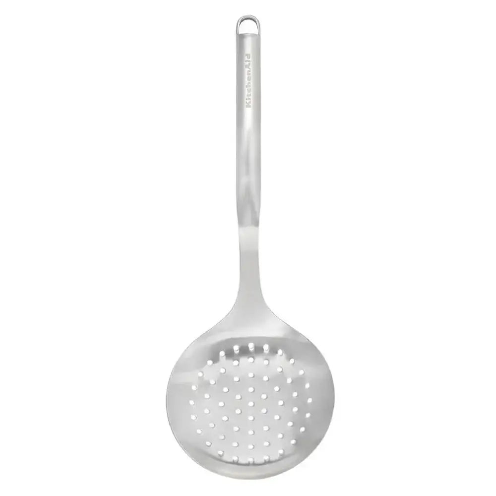 Metallic ladle with perforated spoon on a white background