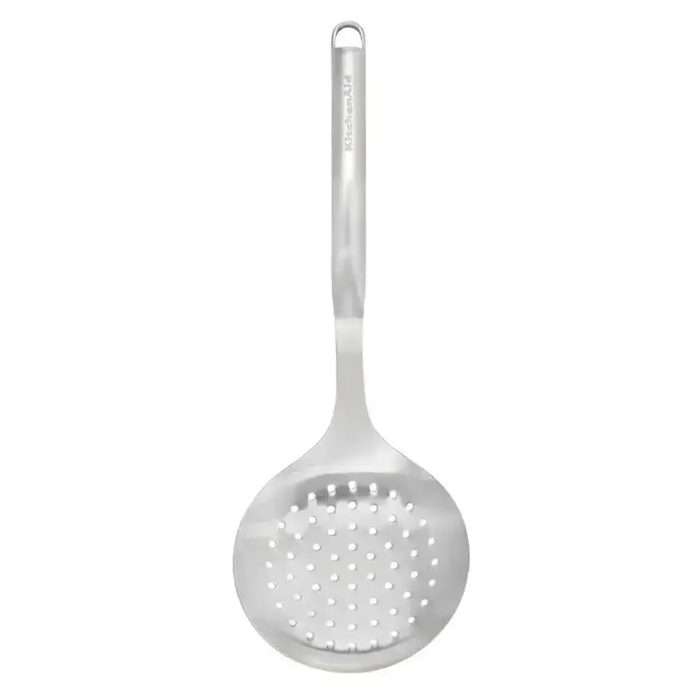 Metallic ladle with perforated spoon on a white background