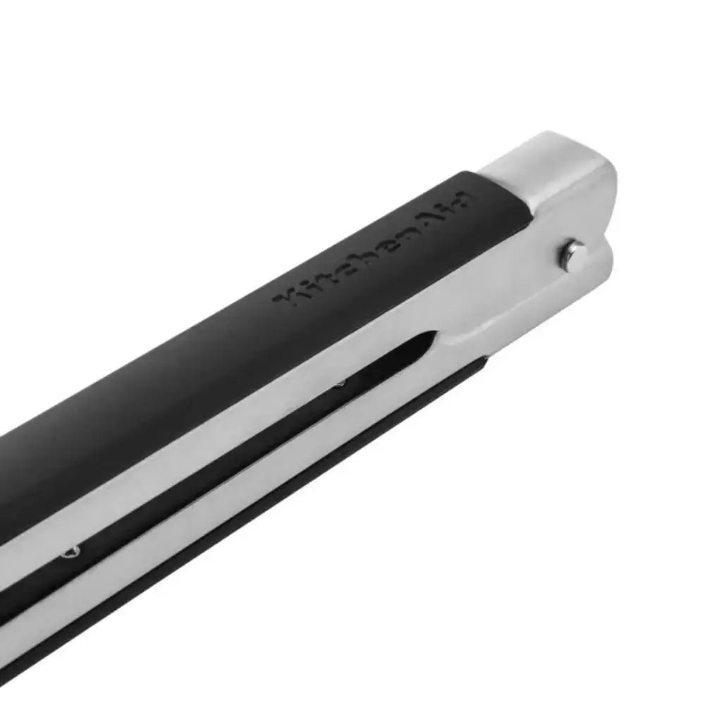 Close-up of a black and silver tong grips on a white background