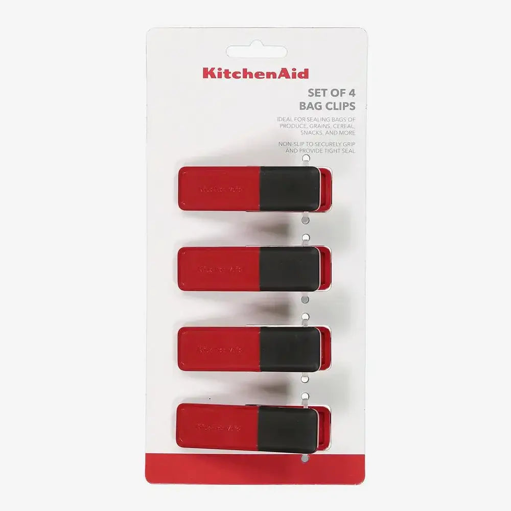 Set of four red and black bag clips on KitchenAid packaging.