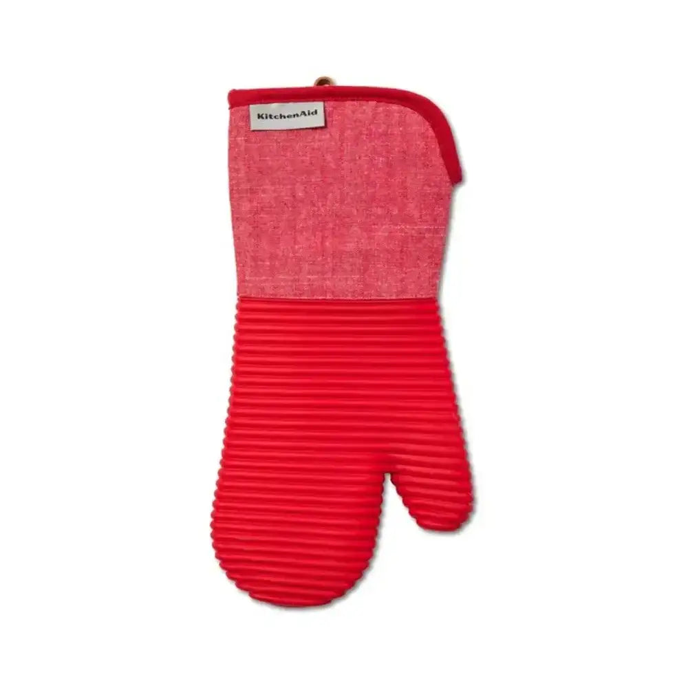 Red oven mitt with ribbed design on a white background