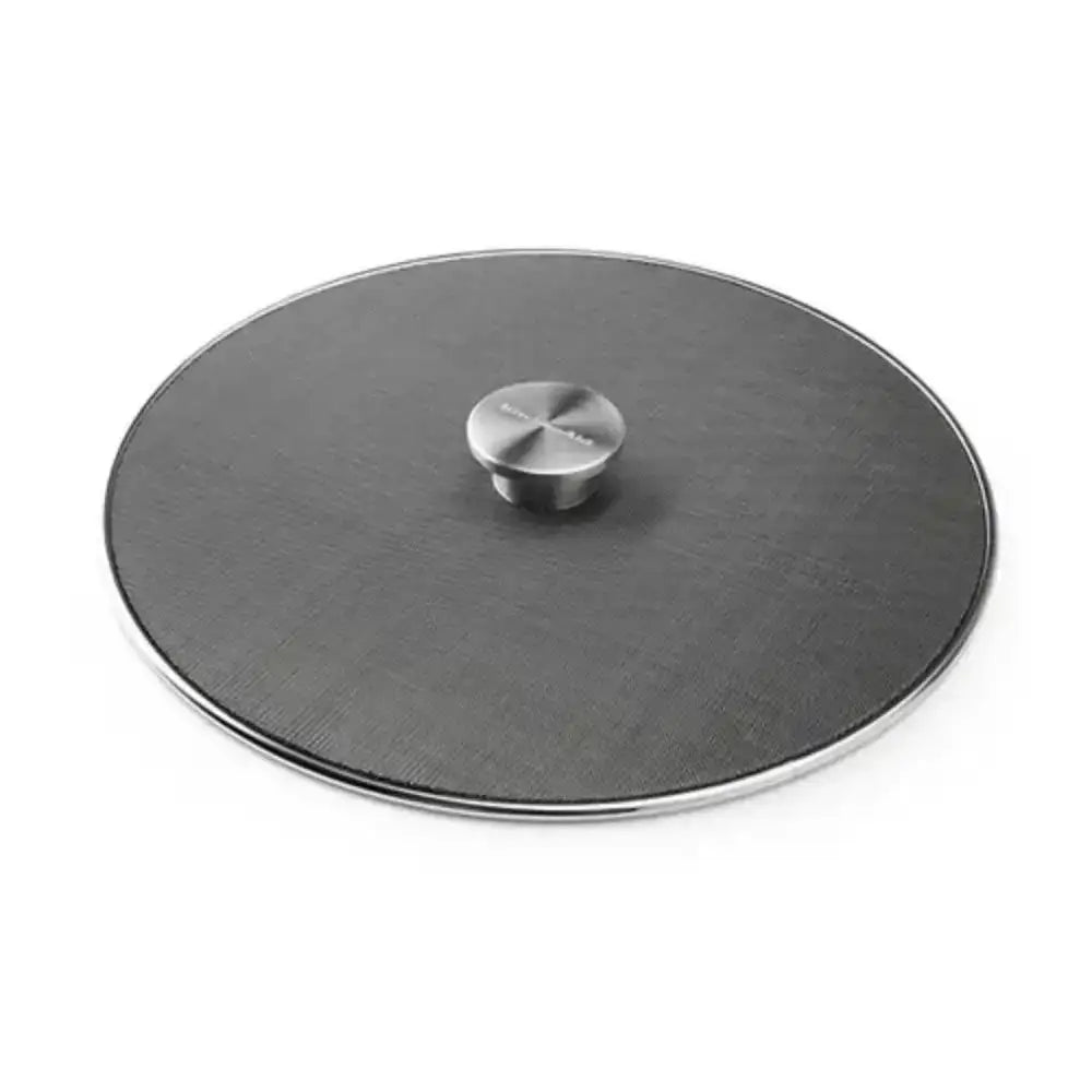 Round glass lid with metallic knob on a white background