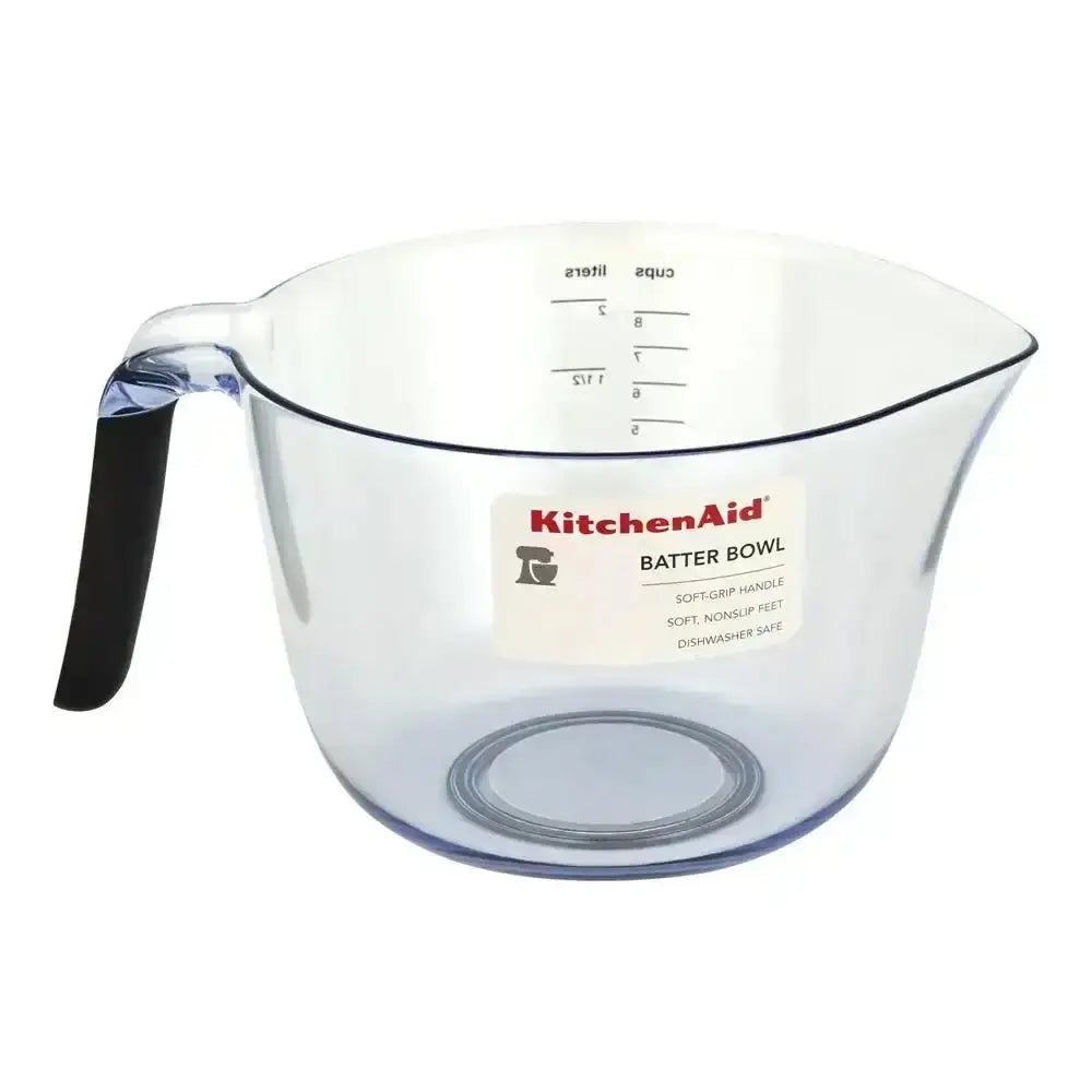 Clear KitchenAid batter bowl with black handle on a white background