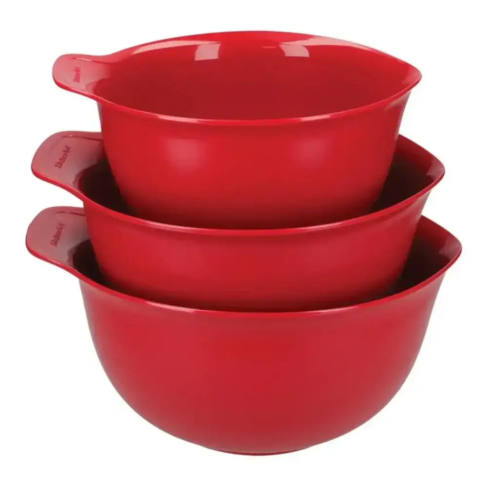 Set of three red mixing bowls stacked on a white background