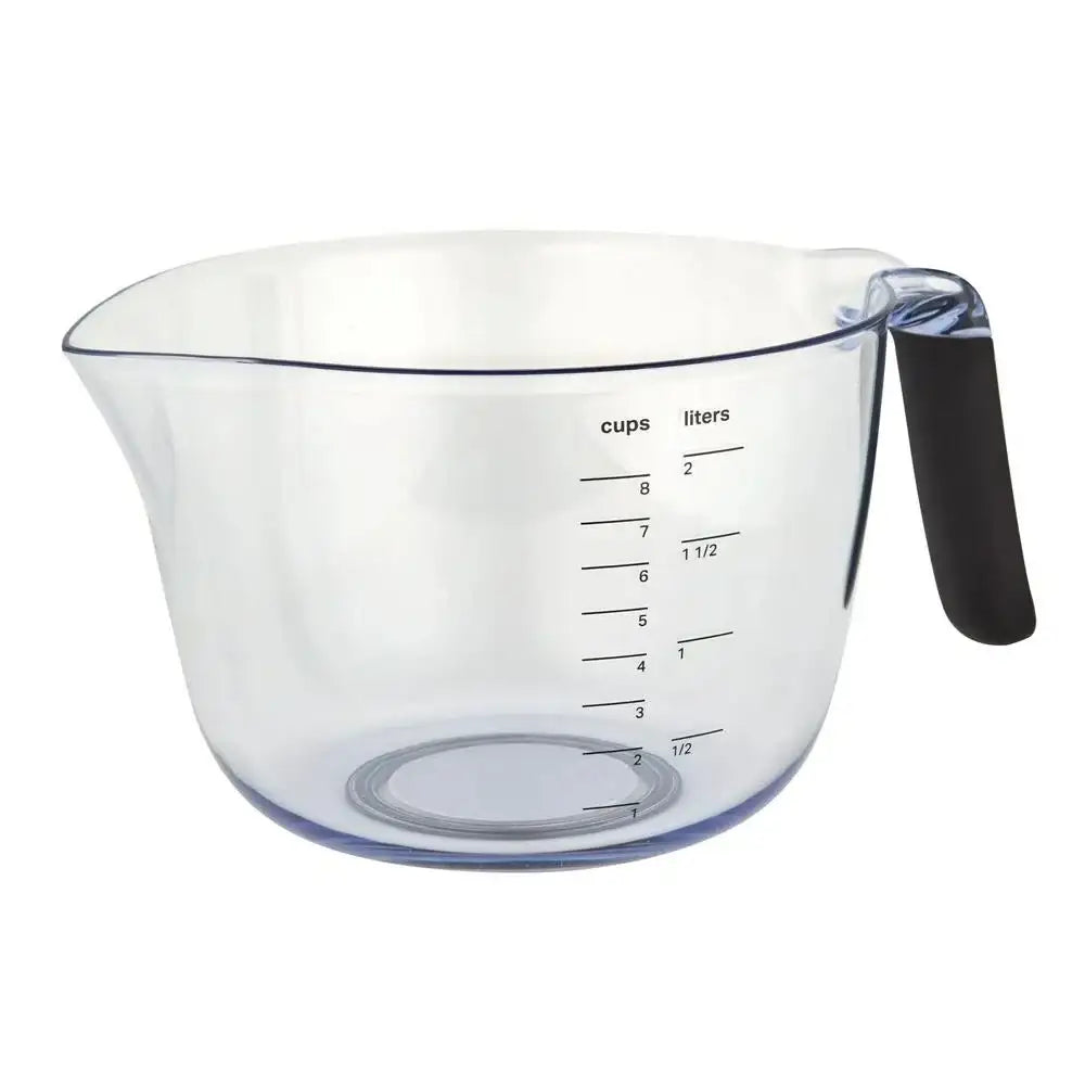 Clear measuring cup with black handle on a white background