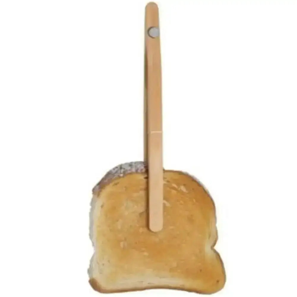 Wooden food tongs holding a piece of toast on a white background