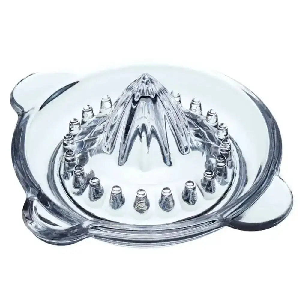 Clear glass manual juicer on a white background