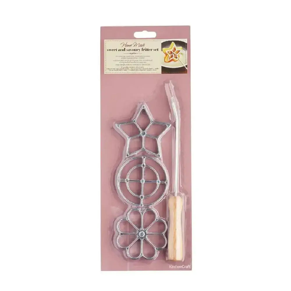 Decorative metal cutting dies with a wooden handle in packaging on a white background