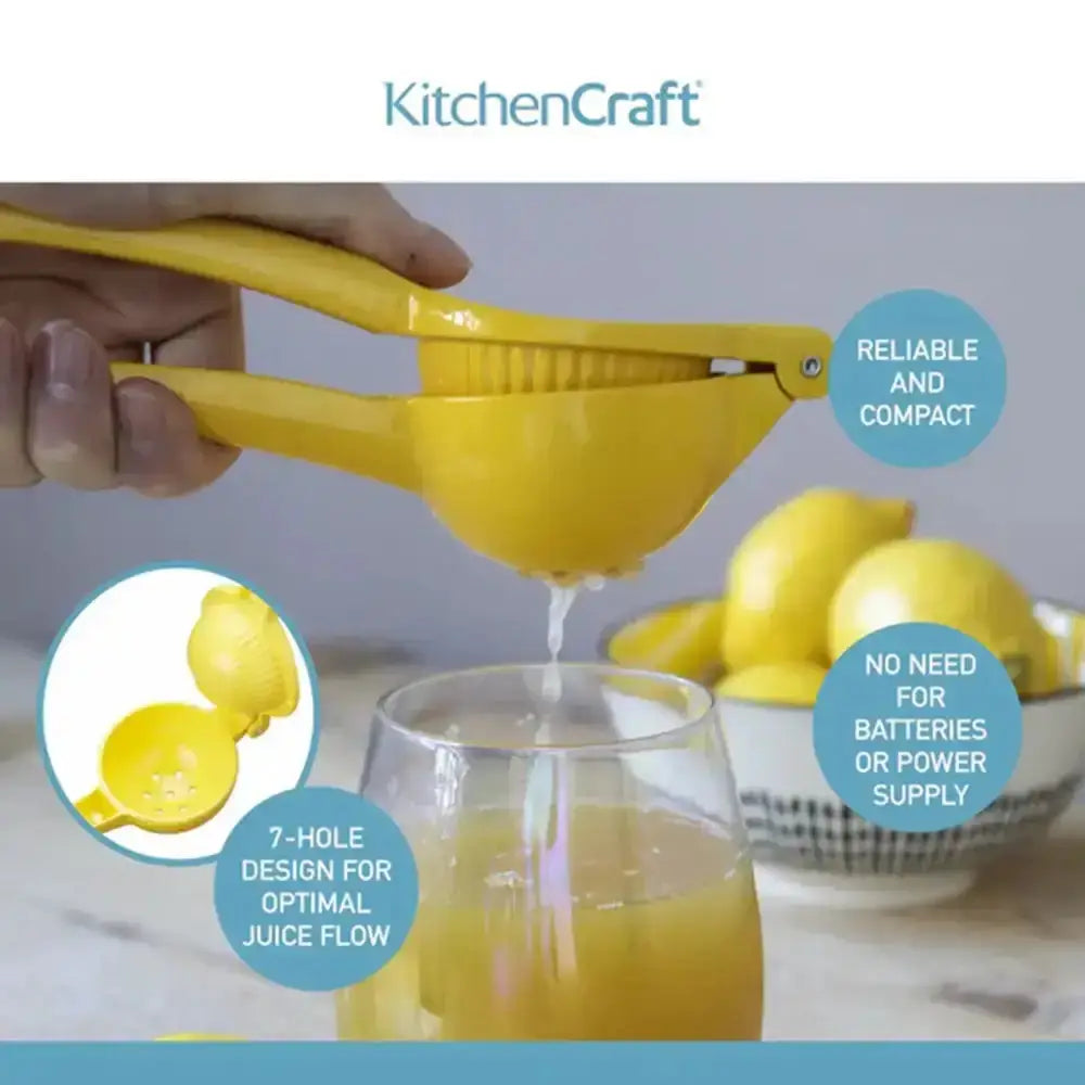 Yellow kitchen juicer being used to extract juice into a glass, with lemons and a bowl in the background.