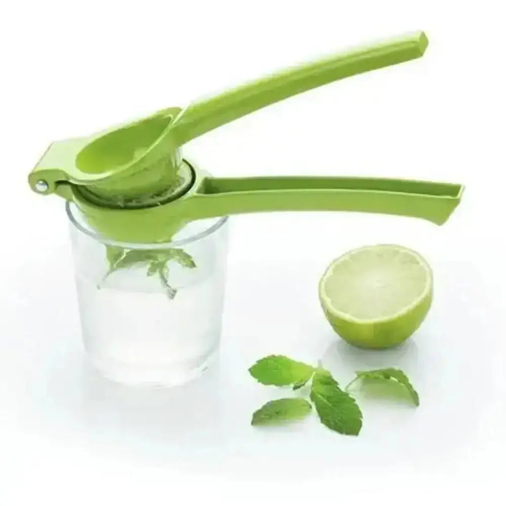 Green manual lime squeezer with a half-lime and mint leaves on a white background
