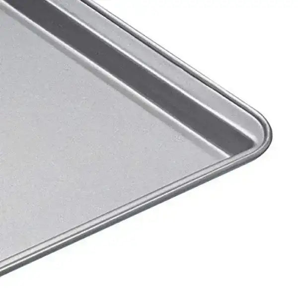 Silver-colored rectangular kitchencraft non-stick oven tray 43cm with raised rim and smooth surface for baking