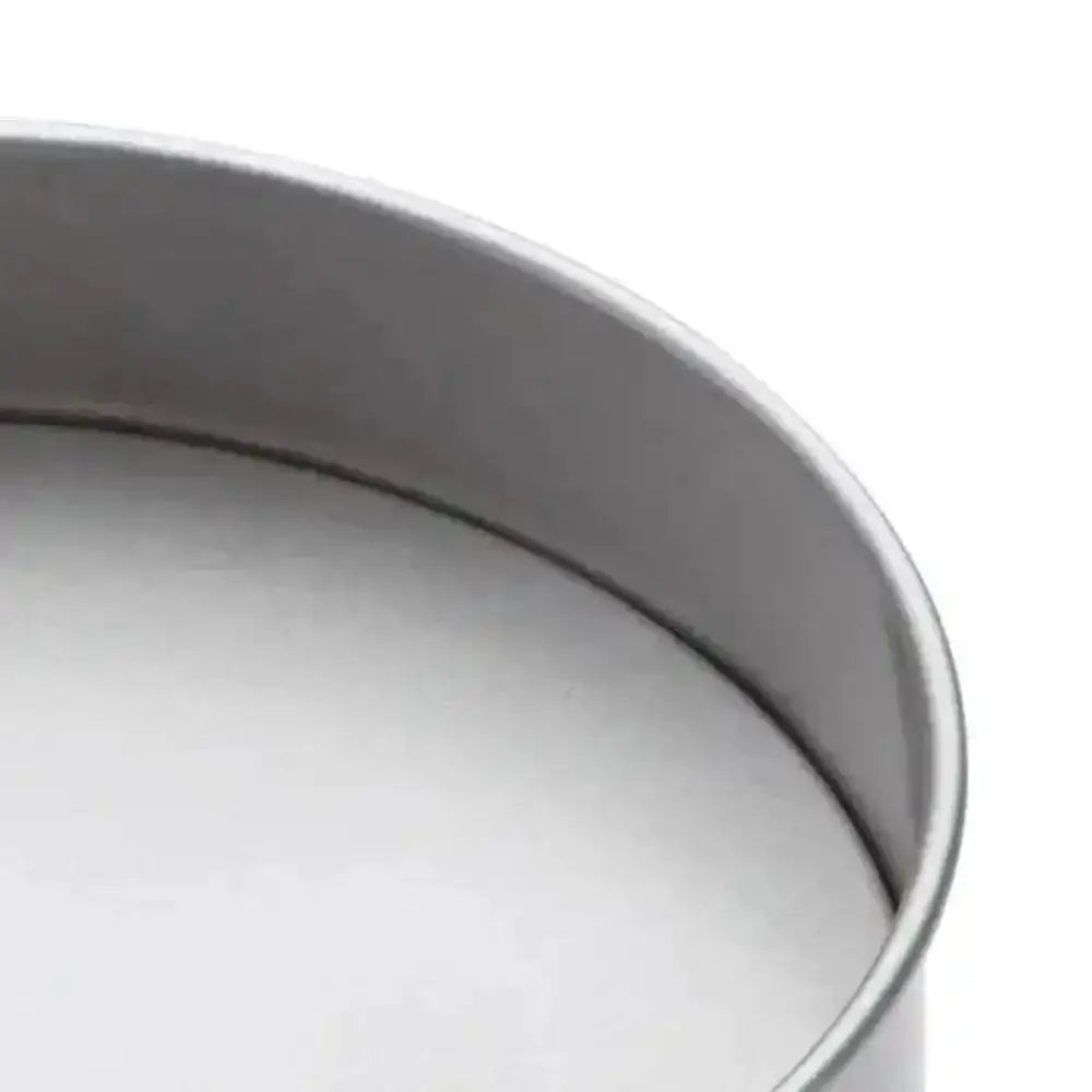 Close-up of a metal baking pan on a white background