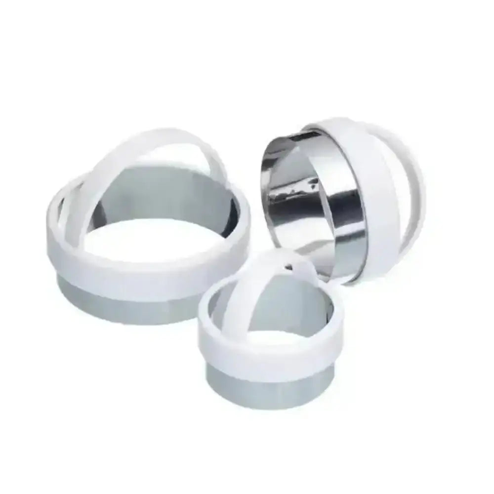 Set of white and silver circular objects on a white background