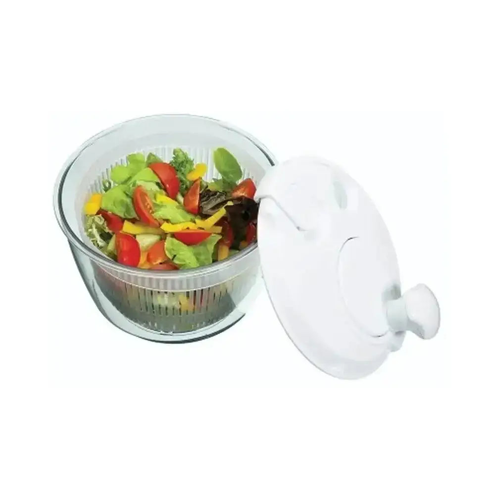 Salad spinner with fresh vegetables on a white background