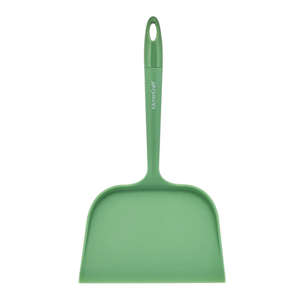 Green dustpan with handle on a white background
