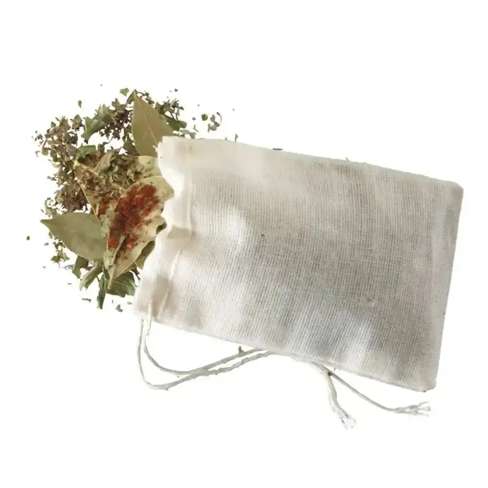 White drawstring bag with dried herbs on a white background